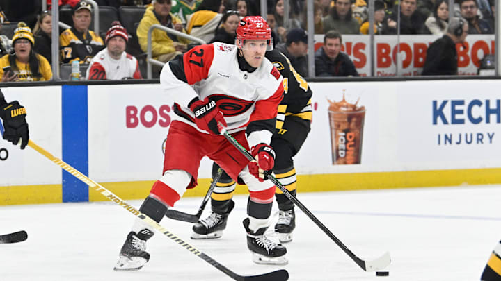 Nov 1, 2025; Boston, Massachusetts, USA; Carolina Hurricanes left wing Nikolaj Ehlers (27) looks to pass the puck during the second period against the Boston Bruins at TD Garden. Mandatory Credit: Eric Canha-Imagn Images