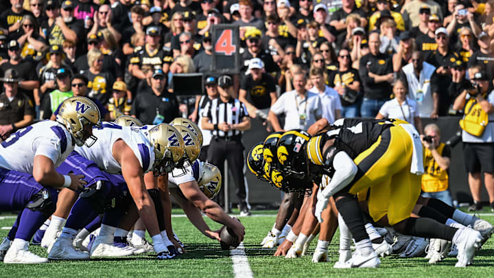 Oct 12, 2024; Iowa City, Iowa, USA;  The Washington Huskies gets set for a snap at the line of scrimmage against the Iowa Hawkeye during the first quarter at Kinnick Stadium. Mandatory Credit: Jeffrey Becker-Imagn Images