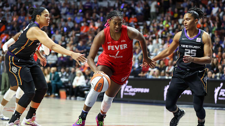South Carolina basketball legend Aliyah Boston driving to the basket in the WNBA Playoffs