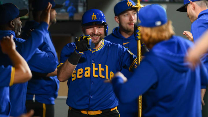 Seattle Mariners designated hitter Cal Raleigh celebrates after hitting a home run against the Oakland Athletics on Friday at T-Mobile Park.