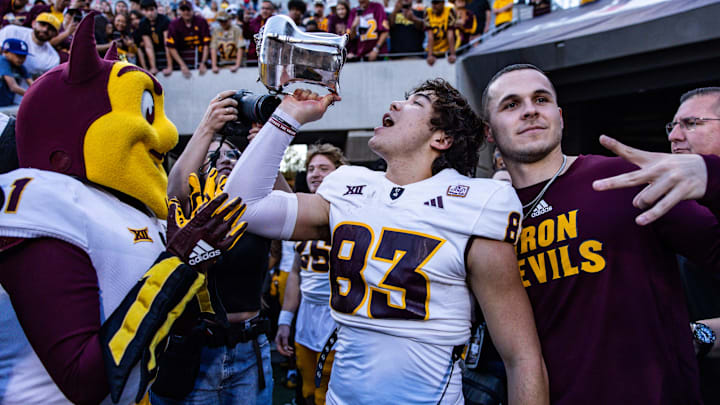 Nov 30, 2024; Tucson, Arizona, USA; Arizona State Sun Devils wide receiver Derek Eusebio (83) drinks out of the Territorial Cup at the end of the game against the Arizona Wildcats at Arizona Stadium. 