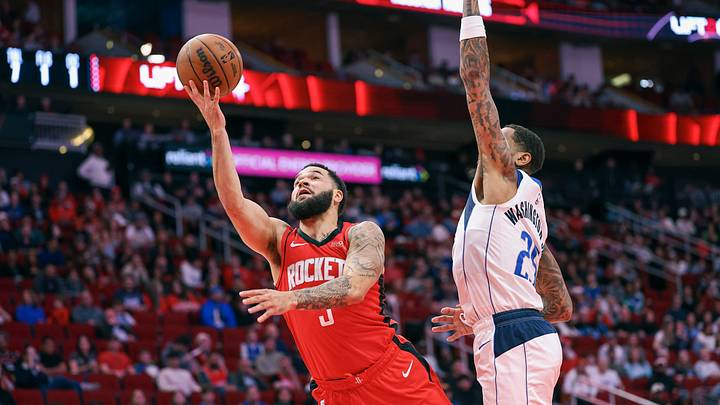 Jan 1, 2025; Houston, Texas, USA; Houston Rockets guard Fred VanVleet (5) shoots the ball as Dallas Mavericks forward P.J. Washington (25) defends during the first quarter at Toyota Center. Mandatory Credit: Troy Taormina-Imagn Images