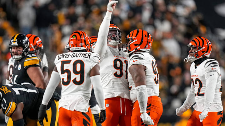 Cincinnati Bengals defensive end Trey Hendrickson (91) celebrates after sacking Pittsburgh Steelers quarterback Russell Wilson (3) in the first quarter of the NFL Week 18 game between the Pittsburgh Steelers and the Cincinnati Bengals at Acrisure Stadium in Pittsburgh on Saturday, Jan. 4, 2025.