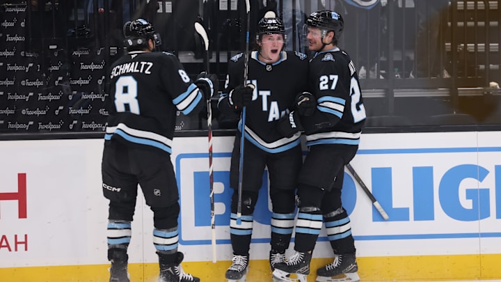 Jan 20, 2025; Salt Lake City, Utah, USA; Utah Hockey Club center Logan Cooley (92) celebrates a goal with center Nick Schmaltz (8) and center Barrett Hayton (27) against the Winnipeg Jets during the second period at Delta Center. Mandatory Credit: Rob Gray-Imagn Images
