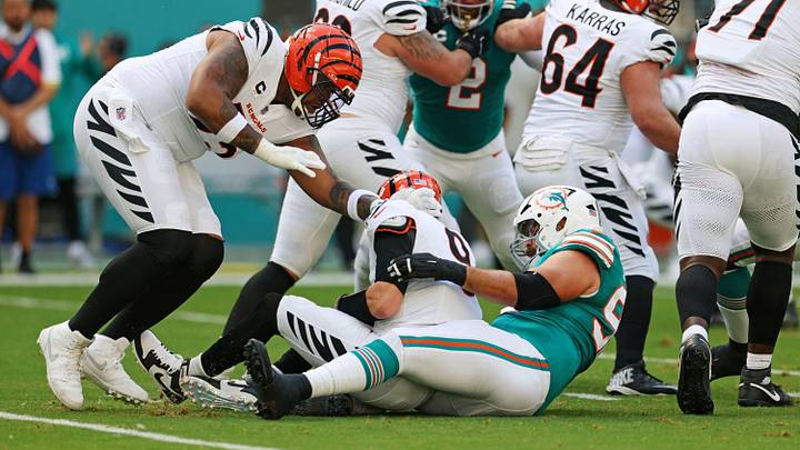 Dec 21, 2025; Miami Gardens, Florida, USA; Cincinnati Bengals quarterback Joe Burrow (9) is sacked by Cincinnati Bengals defensive tackle B.J. Hill (92) during the first quarter against the Cincinnati Bengals at Hard Rock Stadium. Mandatory Credit: Nathan Ray Seebeck-Imagn Images Dec 21, 2025; Miami Gardens, Florida, USA; Cincinnati Bengals quarterback Joe Burrow (9) is sacked by Cincinnati Bengals defensive tackle B.J. Hill (92) during the first quarter against the Cincinnati Bengals at Hard Rock Stadium. Mandatory Credit: Nathan Ray Seebeck-Imagn Images