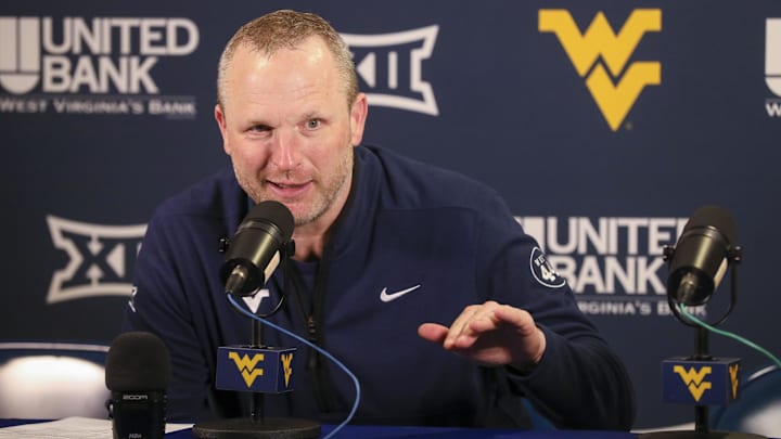 Mar 8, 2025; Morgantown, West Virginia, USA; West Virginia Mountaineers head coach Darian DeVries answers questions from the media after defeating the UCF Knights at WVU Coliseum. Mandatory Credit: Ben Queen-Imagn Images