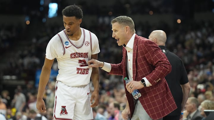 Mar 24, 2024; Spokane, WA, USA; Alabama Crimson Tide guard Rylan Griffen (3) celebrates with Alabama Crimson Tide head coach Nate Oates in the second half against the Grand Canyon Antelopes at Spokane Veterans Memorial Arena. Mandatory Credit: Kirby Lee-Imagn Images