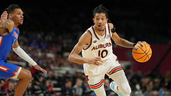Apr 5, 2025; San Antonio, TX, USA; Auburn Tigers guard Chad Baker-Mazara (10) drives to the basket against the Florida Gators during the first half in the semifinals of the men's Final Four of the 2025 NCAA Tournament at the Alamodome. Mandatory Credit: Bob Donnan-Imagn Images Apr 5, 2025; San Antonio, TX, USA; Auburn Tigers guard Chad Baker-Mazara (10) drives to the basket against the Florida Gators during the first half in the semifinals of the men's Final Four of the 2025 NCAA Tournament at the Alamodome. Mandatory Credit: Bob Donnan-Imagn Images