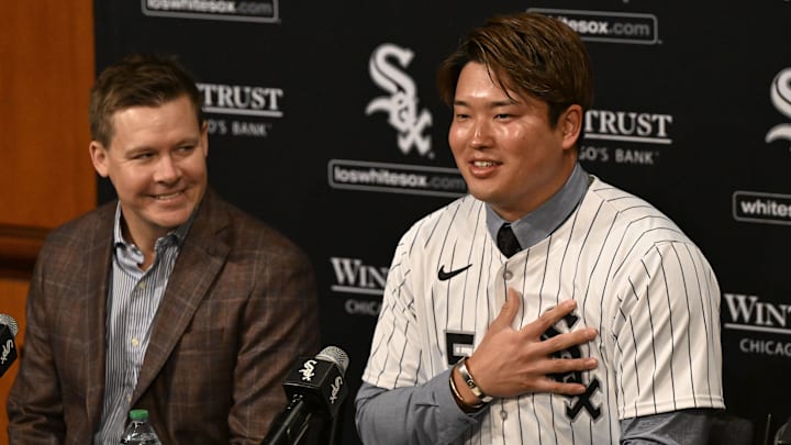 New Chicago White Sox infielder Munetaka Murakami, right, speaks with general manager Chris Getz, left,  during a press conference  where he was introduced at Rate Field. 