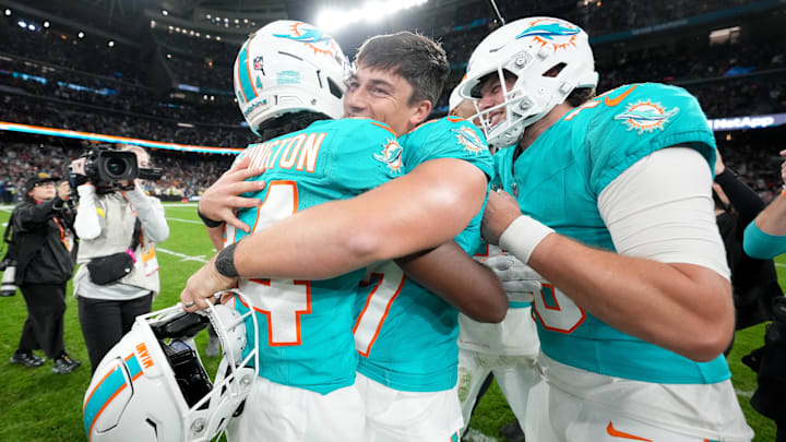 Miami Dolphins wide receiver Tahj Washington (84) congratulates place kicker Riley Patterson (47) after the 2025 NFL Madrid Game against the Washington Commanders at Santiago Bernabeu Stadium. Miami Dolphins wide receiver Tahj Washington (84) congratulates place kicker Riley Patterson (47) after the 2025 NFL Madrid Game against the Washington Commanders at Santiago Bernabeu Stadium.