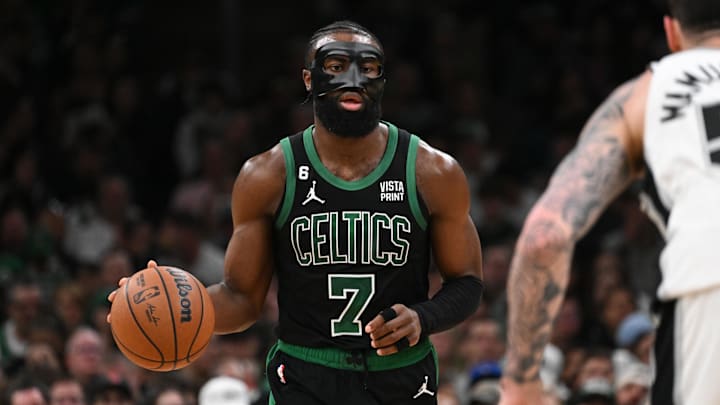 Mar 26, 2023; Boston, Massachusetts, USA; Boston Celtics guard Jaylen Brown (7) dribbles the ball against the San Antonio Spurs during the third quarter at the TD Garden. Mandatory Credit: Brian Fluharty-Imagn Images