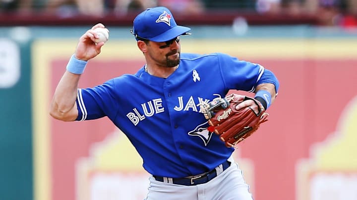 Jun 12, 2013; Arlington, TX, USA; Toronto Blue Jays second baseman Mark DeRosa (16) makes a throw to first during the game against the Texas Rangers at Rangers Ballpark in Arlington. 
