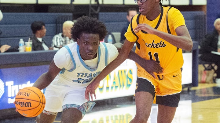 Richland's Phil Nelson (20) drives toward the basket past Starkville defender Justin Green (11) during the BA$$A Holiday Invitational 2023 in Clinton, Miss., Saturday, Dec. 23, 2023.