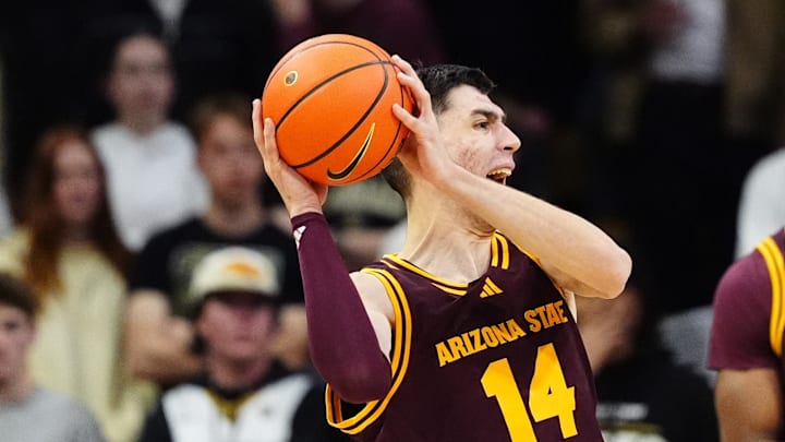 Feb 7, 2026; Boulder, Colorado, USA; Colorado Buffaloes guard Jalin Holland (11) defends on Arizona State Sun Devils forward Andrija Grbovic (14) in the second half at the CU Events Center. Mandatory Credit: Ron Chenoy-Imagn Images