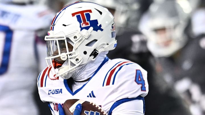 Louisiana Tech Bulldogs running back Clay Thevenin (4) carries the ball against the Washington State Cougars Louisiana Tech Bulldogs running back Clay Thevenin (4) carries the ball against the Washington State Cougars