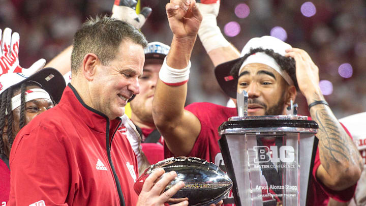 Indiana Head Coach Curt Cignetti and the Hoosies celebrate after the Indiana versus Ohio State BIg Ten Championship football game at Lucas Oil Stadium.