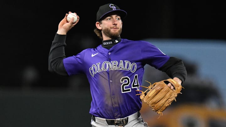 May 1, 2025; San Francisco, California, USA; Colorado Rockies third baseman Ryan McMahon (24) throws to first base for an out against the San Francisco Giants in the seventh inning at Oracle Park
