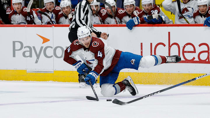 Feb 24, 2024; Denver, Colorado, USA; Colorado Avalanche defenseman Bowen Byram (4) falls to the ice