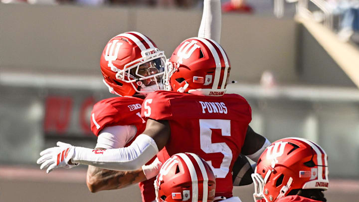 Aug 30, 2025; Bloomington, Indiana, USA; Indiana Hoosiers defensive back Amare Ferrell (1) celebrates with Indiana Hoosiers defensive back D'Angelo Ponds (5) after an interception during the second half against the Old Dominion Monarchs at Memorial Stadium. Mandatory Credit: Robert Goddin-Imagn Images