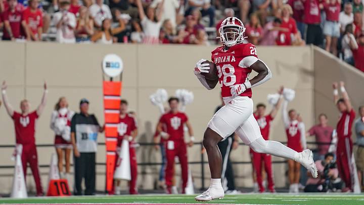 Sep 12, 2025; Bloomington, Indiana, USA; Indiana Hoosiers running back Khobie Martin (28) runs for a touchdown during the second half against the Indiana State Sycamores at Memorial Stadium. Mandatory Credit: Robert Goddin-Imagn Images