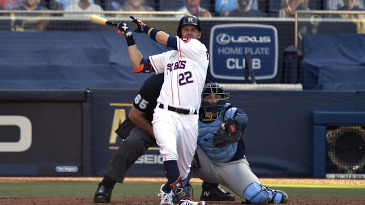 Oct 15, 2020; San Diego, California, USA; Houston Astros right fielder Josh Reddick (22) hits a single against the Tampa Bay Rays in the third inning against the Tampa Bay Rays during game five of the 2020 ALCS at Petco Park. Mandatory Credit: Robert Hanashiro-Imagn Images Oct 15, 2020; San Diego, California, USA; Houston Astros right fielder Josh Reddick (22) hits a single against the Tampa Bay Rays in the third inning against the Tampa Bay Rays during game five of the 2020 ALCS at Petco Park. Mandatory Credit: Robert Hanashiro-Imagn Images