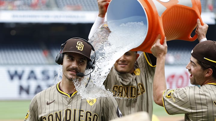 Jul 25, 2024; Washington, District of Columbia, USA; San Diego Padres starting pitcher Dylan Cease (84) is doused with a Gatorade cooler by Padres third baseman Manny Machado (13) and Padres third baseman Tyler Wade (14) while waiting for an on-air interview after throwing a no-hitter against the Washington Nationals at Nationals Park. Mandatory Credit: Geoff Burke-Imagn Images Jul 25, 2024; Washington, District of Columbia, USA; San Diego Padres starting pitcher Dylan Cease (84) is doused with a Gatorade cooler by Padres third baseman Manny Machado (13) and Padres third baseman Tyler Wade (14) while waiting for an on-air interview after throwing a no-hitter against the Washington Nationals at Nationals Park. Mandatory Credit: Geoff Burke-Imagn Images