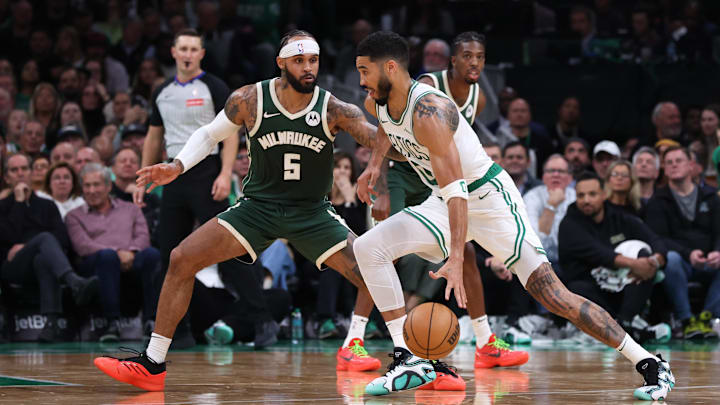 Oct 28, 2024; Boston, Massachusetts, USA; Boston Celtics forward Jayson Tatum (0) dribbles down the court defended by Milwaukee Bucks guard Gary Trent Jr (5) during the first half at TD Garden. Mandatory Credit: Paul Rutherford-Imagn Images Oct 28, 2024; Boston, Massachusetts, USA; Boston Celtics forward Jayson Tatum (0) dribbles down the court defended by Milwaukee Bucks guard Gary Trent Jr (5) during the first half at TD Garden. Mandatory Credit: Paul Rutherford-Imagn Images