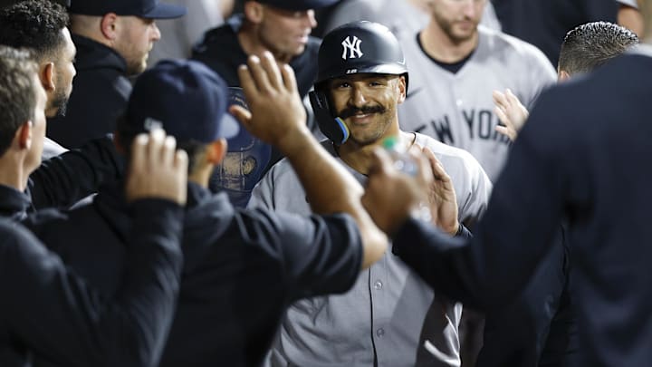 Aug 30, 2025; Chicago, Illinois, USA; New York Yankees center fielder Trent Grisham (12) celebrates with teammates in the dugout after scoring against the Chicago White Sox during the 11th inning at Rate Field. Mandatory Credit: Kamil Krzaczynski-Imagn Images Aug 30, 2025; Chicago, Illinois, USA; New York Yankees center fielder Trent Grisham (12) celebrates with teammates in the dugout after scoring against the Chicago White Sox during the 11th inning at Rate Field. Mandatory Credit: Kamil Krzaczynski-Imagn Images