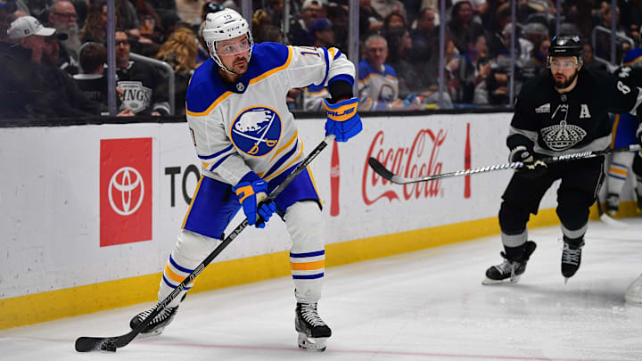 Mar 21, 2026; Los Angeles, California, USA; Buffalo Sabres center Sam Carrick (10) coontrols the puck against the Los Angeles Kings during the third period at Crypto.com Arena. Mandatory Credit: Gary A. Vasquez-Imagn Images