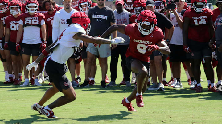 Oklahoma receiver Keontez Lewis battles in a one-on-one drill at practice.