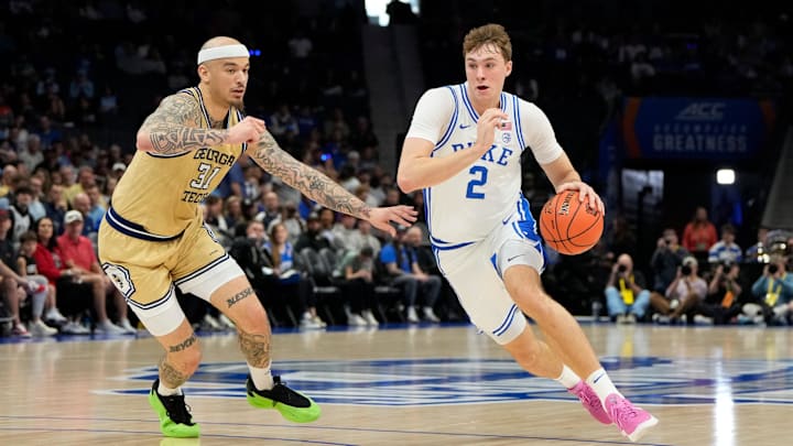 Mar 13, 2025; Charlotte, NC, USA; Duke Blue Devils forward Cooper Flagg (2) with the ball as Georgia Tech Yellow Jackets forward Duncan Powell (31) defends in the first half at Spectrum Center. Mandatory Credit: Bob Donnan-Imagn Images Mar 13, 2025; Charlotte, NC, USA; Duke Blue Devils forward Cooper Flagg (2) with the ball as Georgia Tech Yellow Jackets forward Duncan Powell (31) defends in the first half at Spectrum Center. Mandatory Credit: Bob Donnan-Imagn Images