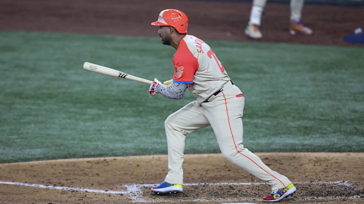 Jul 16, 2024; Arlington, Texas, USA; American League right fielder Anthony Santander of the Baltimore Orioles (25) hits single in the fifth inning during the 2024 MLB All-Star game at Globe Life Field. Mandatory Credit: Tim Heitman-Imagn Images