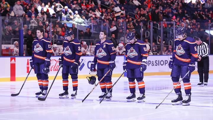 Dec 10, 2022; Elmont, New York, USA;  New York Islanders starters debut the reverse retro jerseys during the national anthem before a game against the Carolina Hurricanes at UBS Arena. Mandatory Credit: Thomas Salus-USA TODAY Sports