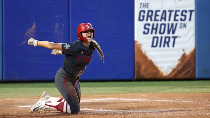 Stanford's Taryn Kern (99) celebrates after scoring a run in the third inning of a Women's College World Series softball game between the Stanford Cardinal and the UCLA Bruins at Devon Park in Oklahoma City, Sunday, June 2, 2024. Stanford won 3-1. Stanford's Taryn Kern (99) celebrates after scoring a run in the third inning of a Women's College World Series softball game between the Stanford Cardinal and the UCLA Bruins at Devon Park in Oklahoma City, Sunday, June 2, 2024. Stanford won 3-1.