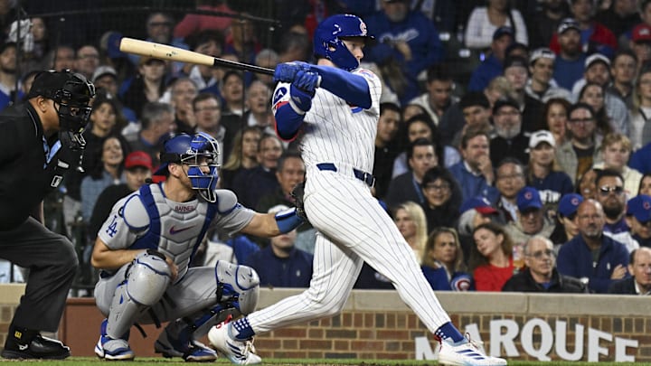 Apr 23, 2025; Chicago, Illinois, USA;  Chicago Cubs outfielder Pete Crow-Armstrong (4) hits an RBI single against the Los Angeles Dodgers during the fifth inning at Wrigley Field. 