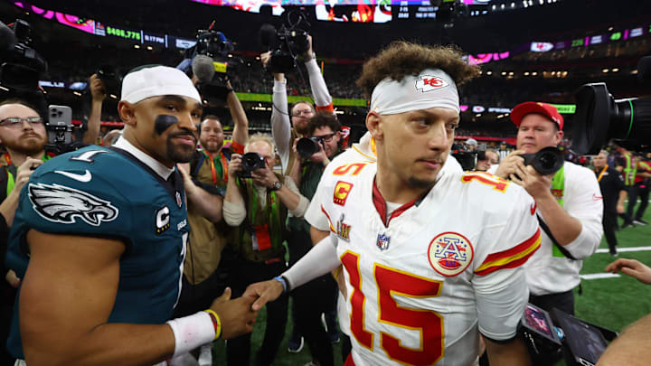 Feb 9, 2025; New Orleans, LA, USA; Philadelphia Eagles quarterback Jalen Hurts (1) shakes hands with Kansas City Chiefs quarterback Patrick Mahomes (15) after Super Bowl LIX at Ceasars Superdome. Mandatory Credit: Mark J. Rebilas-Imagn Images