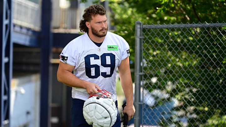 Jul 26, 2023; Foxborough, MA, USA; New England Patriots guard Cole Strange (69) makes his way to the practice fields for  training camp at Gillette Stadium. Mandatory Credit: Eric Canha-Imagn Images