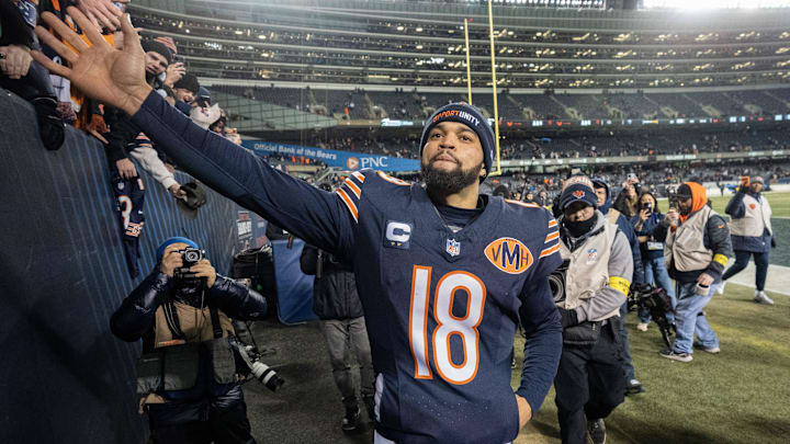 Dec 20, 2025; Chicago, Illinois, USA; Chicago Bears quarterback Caleb Williams (18) high-fives fans after defeating the Green Bay Packers during overtime at Soldier Field. Mandatory Credit: Mark Hoffman-USA TODAY Network via Imagn Images