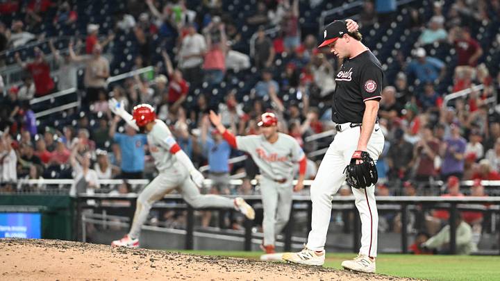 Jun 25, 2026; Washington, District of Columbia, USA; Washington Nationals pitcher Gus Varland (47) reacts after giving up a two run home run to Philadelphia Phillies right fielder Derek Hill (49) during the ninth inning at Nationals Park. Mandatory Credit: Brad Mills-Imagn Images