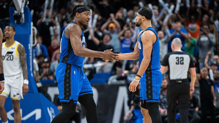 Orlando Magic center Wendell Carter Jr. (34) and guard Jalen Suggs (4) celebrate a three pointer against the Utah Jazz in the fourth quarter at Kia Center. Orlando Magic center Wendell Carter Jr. (34) and guard Jalen Suggs (4) celebrate a three pointer against the Utah Jazz in the fourth quarter at Kia Center.