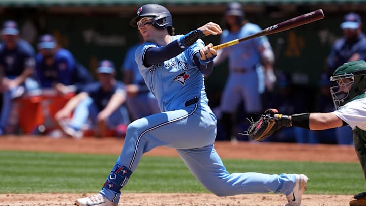 Jun 9, 2024; Oakland, California, USA; Toronto Blue Jays catcher Danny Jansen (9) bats against the Oakland Athletics during the third inning at Oakland-Alameda County Coliseum. Mandatory Credit: Darren Yamashita-USA TODAY Sports