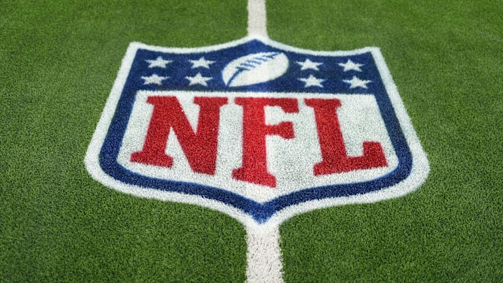 The NFL shield logo is seen on the field at SoFi Stadium before a game between the Arizona Cardinals and Los Angeles Rams.