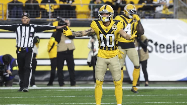 Football player reacts during play on the fiel Football player reacts during play on the fiel