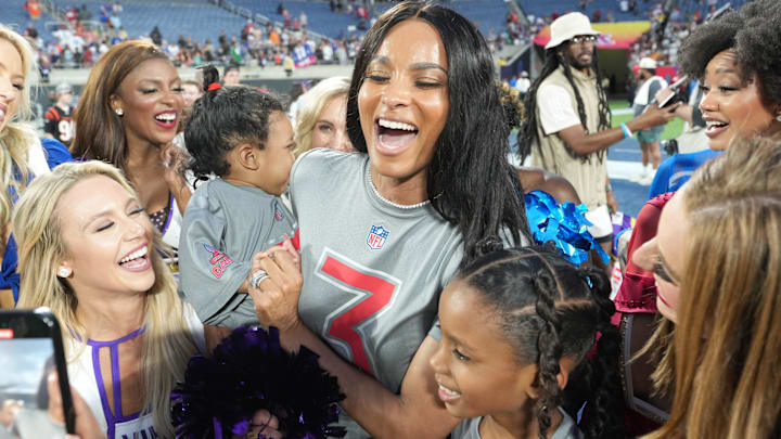 Recording artist Ciara with daughters Sienna Wilson and Amora Wilson pose with cheerleaders during the 2025 Pro Bowl Games at Camping World Stadium.