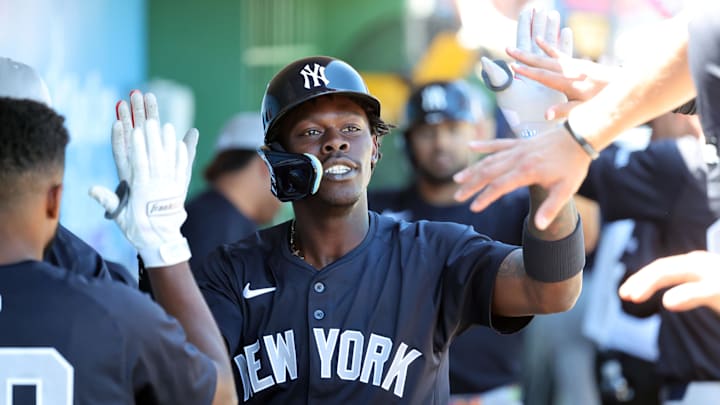New York Yankees third base Jazz Chisholm Jr. (13) is congratulated after he hit a 2-run home run during the third inning against the Philadelphia Phillies at BayCare Ballpark.