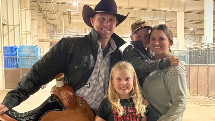Riley Pruitt with his wife Jenna and their two kids after his big win in Loveland. 