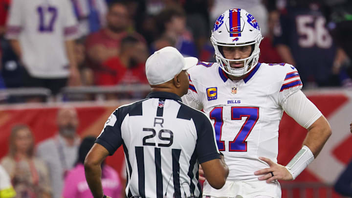 Nov 20, 2025; Houston, Texas, USA; Buffalo Bills quarterback Josh Allen (17) talks with referee Adrian Hill (29) during an officials timeout as he plays against the Houston Texans in the first half  at NRG Stadium. Mandatory Credit: Thomas Shea-Imagn Images