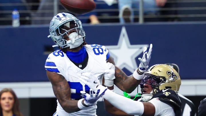 Sep 15, 2024; Arlington, Texas, USA;  New Orleans Saints cornerback Kool-Aid McKinstry (14) breaks up a pass intended for Dallas Cowboys wide receiver CeeDee Lamb (88) during the second half at AT&T Stadium. 