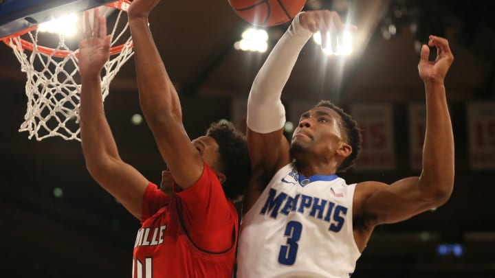 Dec 16, 2017; New York, NY, USA; Memphis Tigers guard Jeremiah Martin (3) blocks a shot against Louisville Cardinals forward Dwayne Sutton (24) in the second half at Madison Square Garden. Dec 16, 2017; New York, NY, USA; Memphis Tigers guard Jeremiah Martin (3) blocks a shot against Louisville Cardinals forward Dwayne Sutton (24) in the second half at Madison Square Garden.