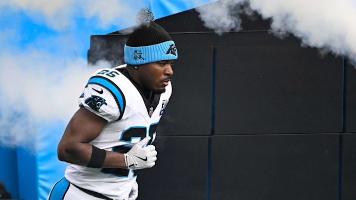 Dec 15, 2024; Charlotte, North Carolina, USA;  Carolina Panthers safety Xavier Woods (25) runs on to the field before the game at Bank of America Stadium. Mandatory Credit: Bob Donnan-Imagn Images